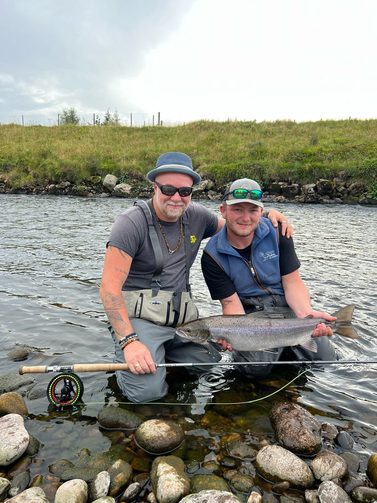 Anglers holding Atlanitc salmon caught on the river Dee at Crathes Castle beat near to Banchory with Levaroa